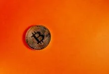 Bitcoin on orange background