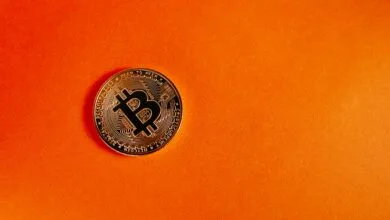 Bitcoin on orange background