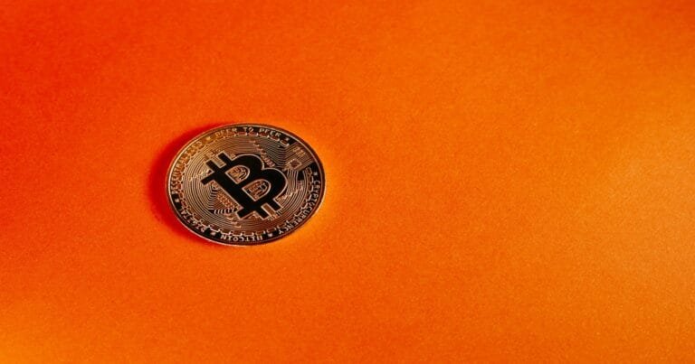 Bitcoin on orange background